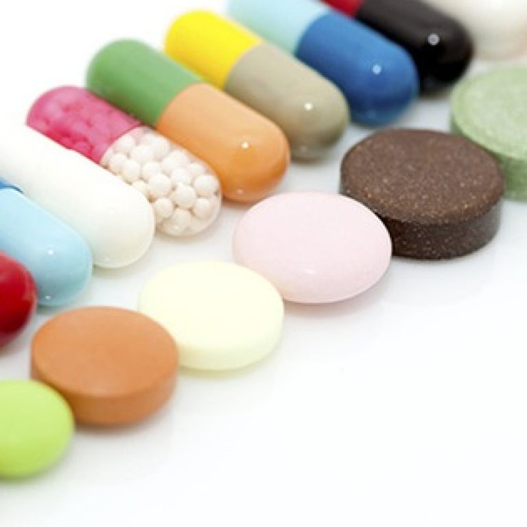 Various capsules and tablets in row